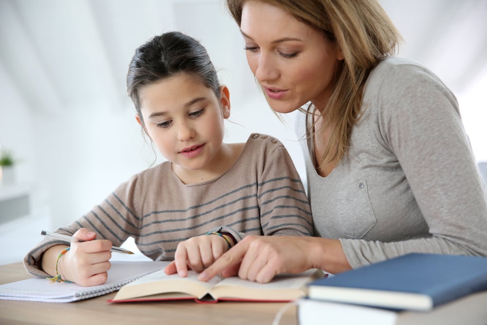 mother and daughter reading together