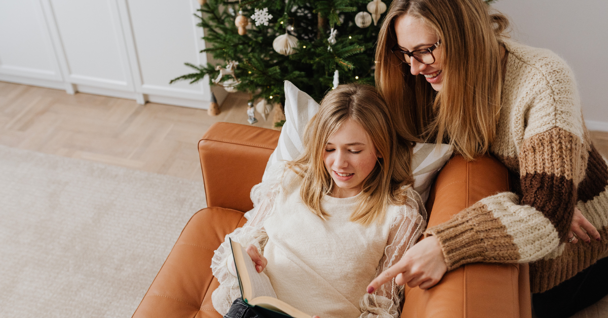 Mother and daughter reading at Christmas