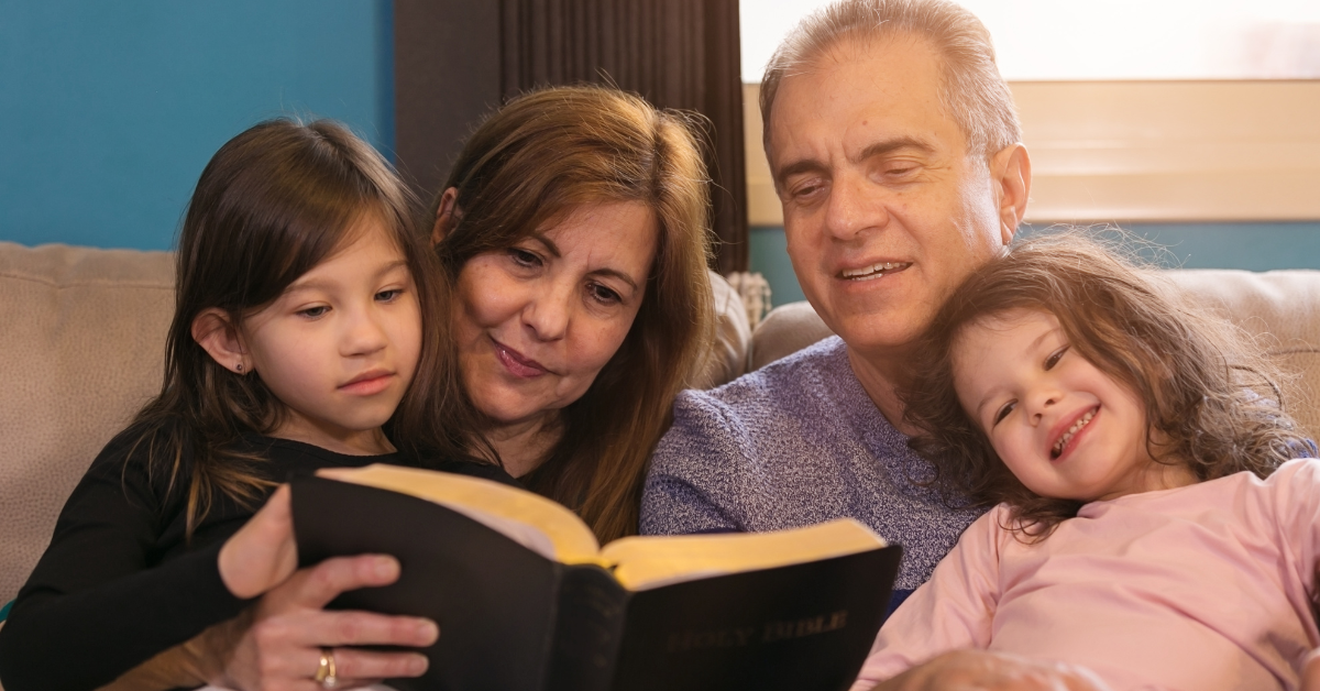 Multiple generations reading scripture together