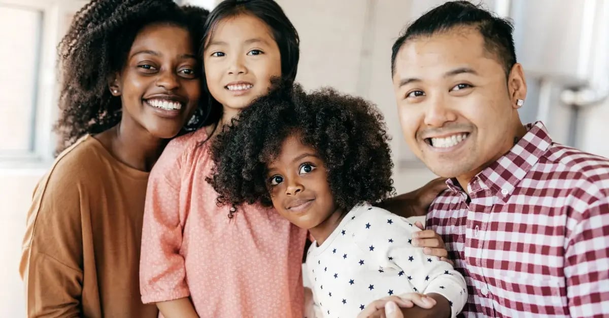 family with little kids smiling