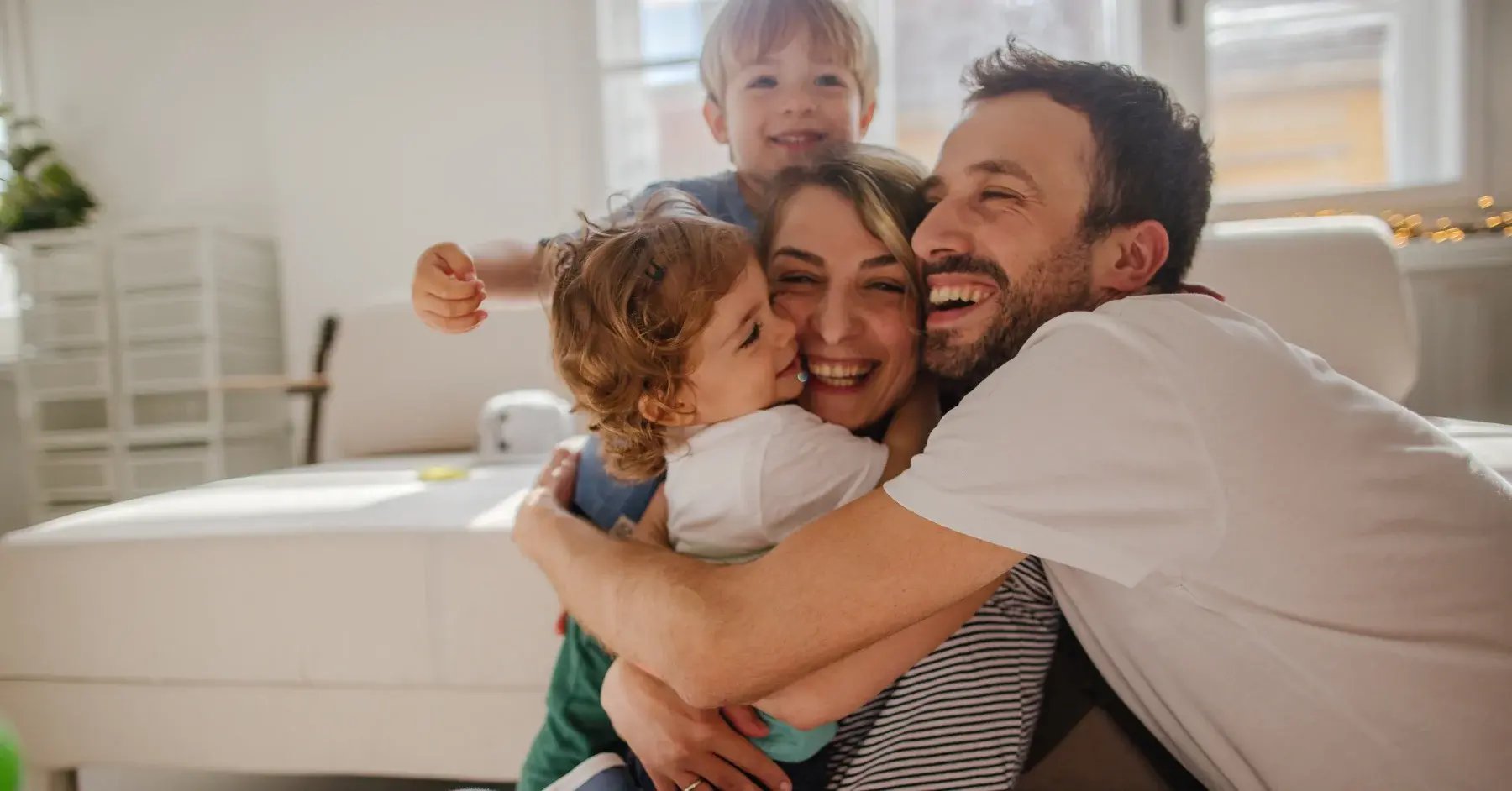 family smiling and hugging