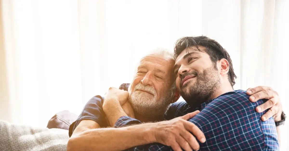 father and son hugging