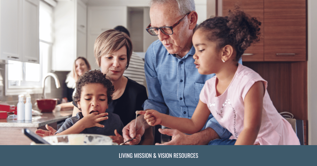 Grandparents baking with two young grandchildren