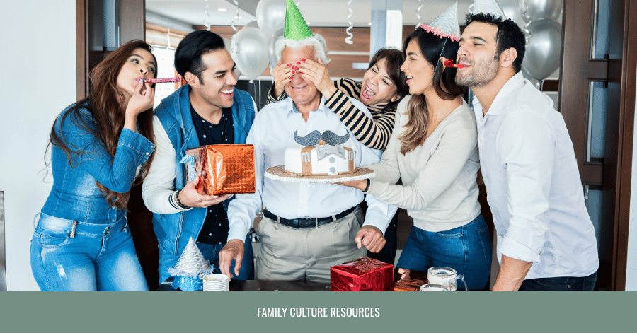 young adults celebrating grandfather with birthday cake