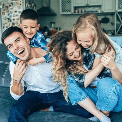 young-family-playing-on-couch