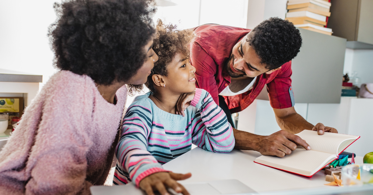 parents-and-child-reading-and-writing-together