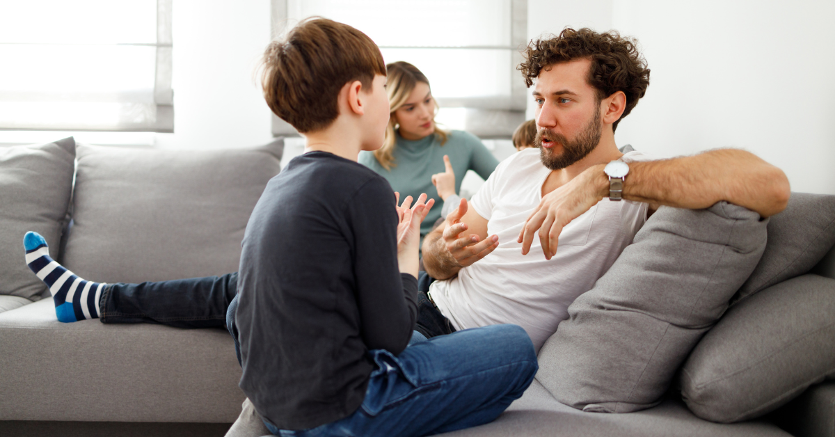 family-talking-and-sitting-on-couch