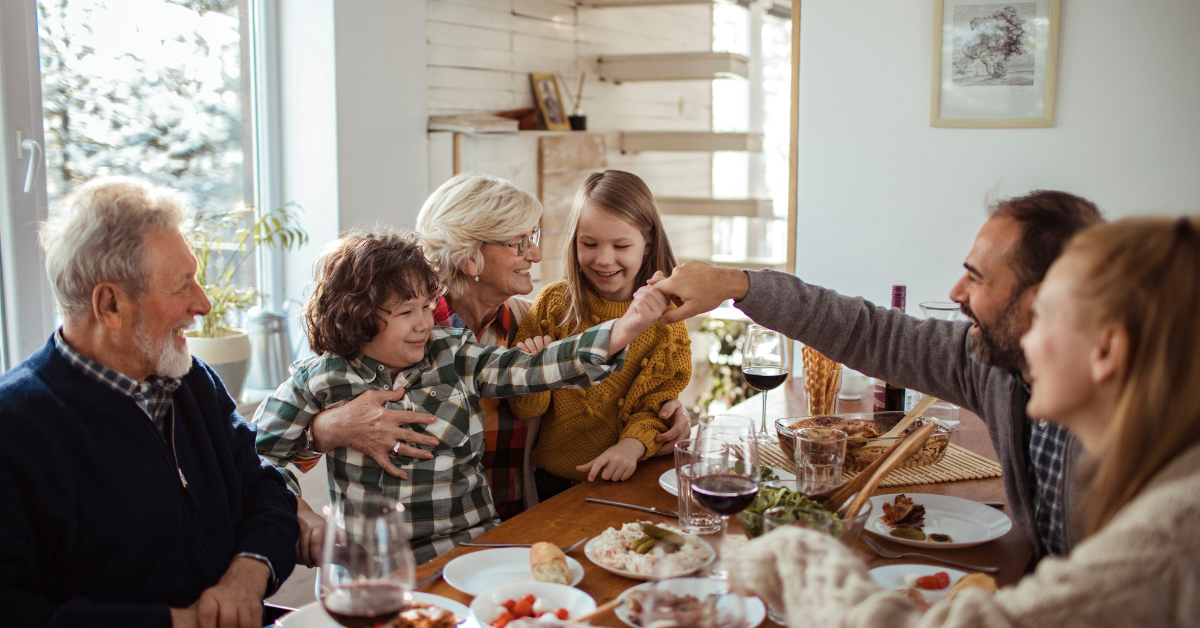 family-eating-dinner-at-the-table-during-the-holidays