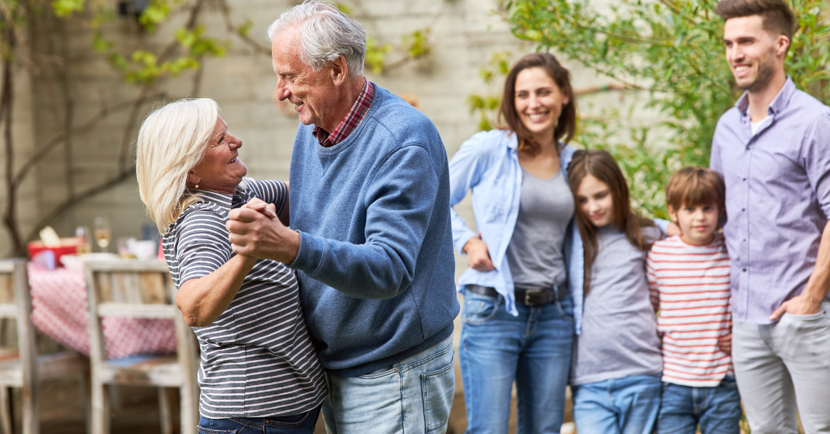 Grandparents-dancing-beside-family