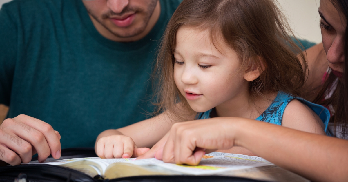 Parents-young-child-reading-scripture-together