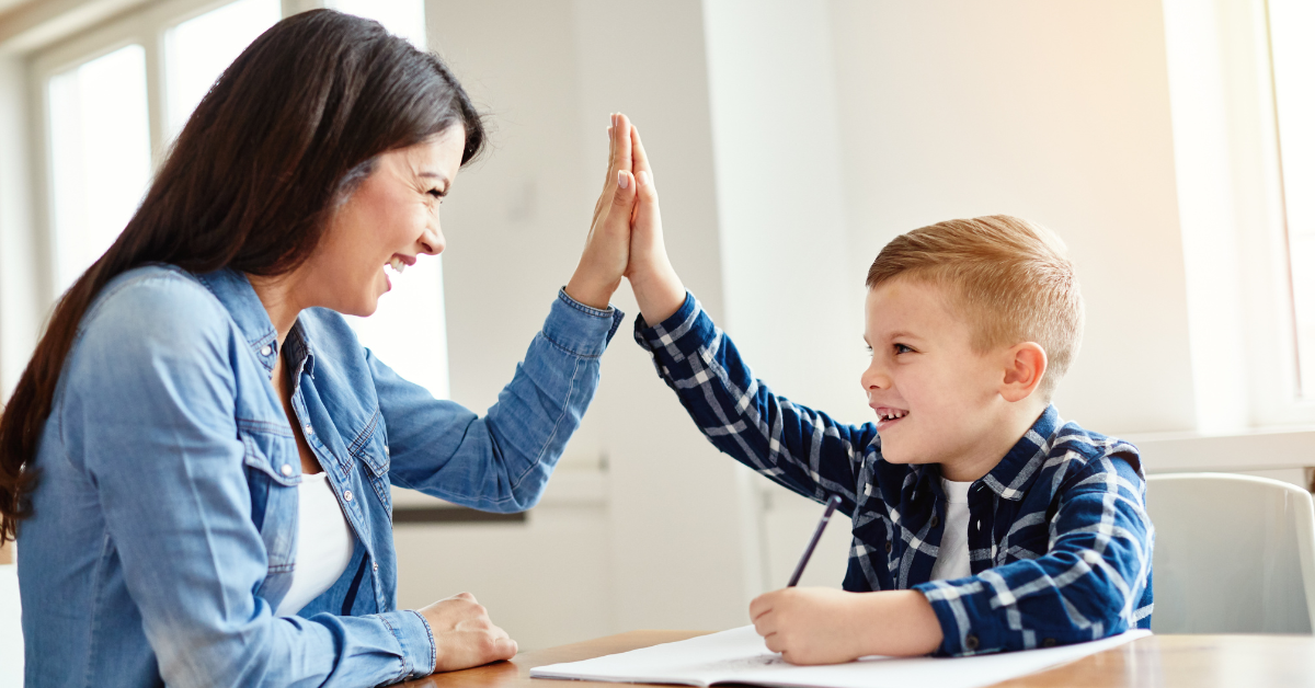 Mother-and-son-high-fiving-after-teaching