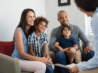 Young parents and two children holding a meeting