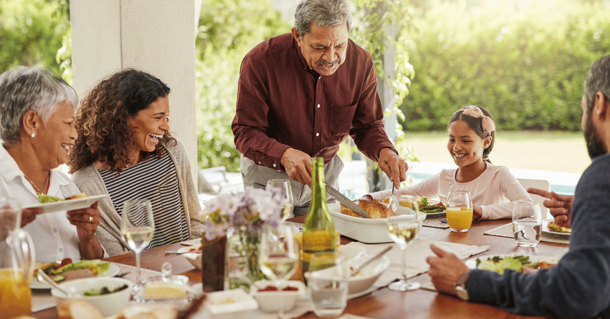 multigenerational family serving dinner